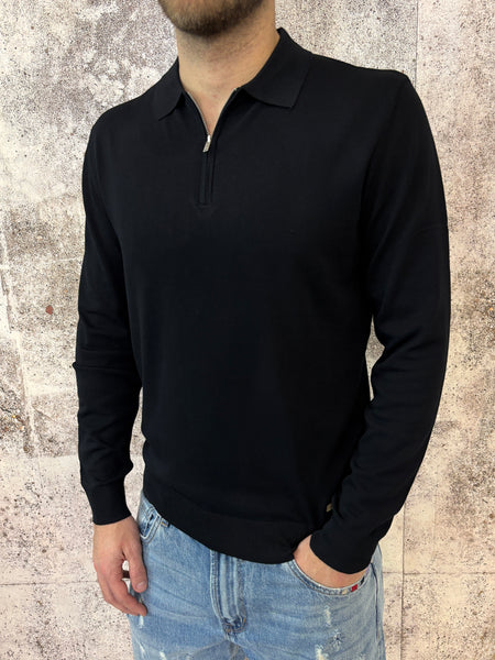 Polo nera con zip manica lunga