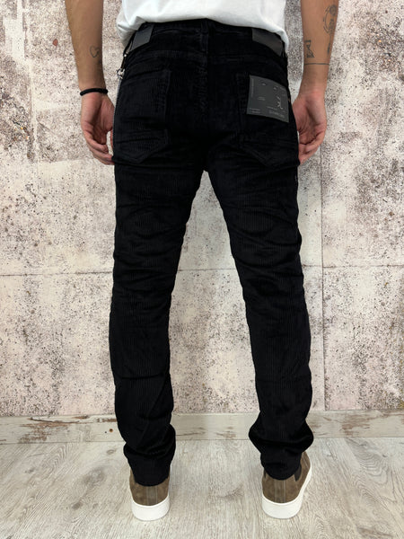 Pantalone velluto nero con rotture e toppe