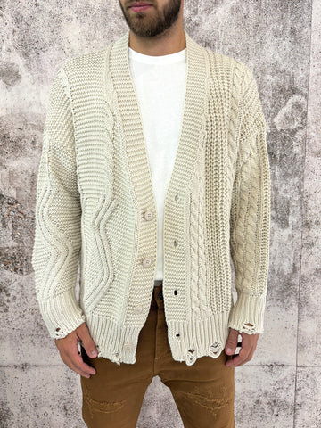 Cardigan avorio con bottoni e rotture