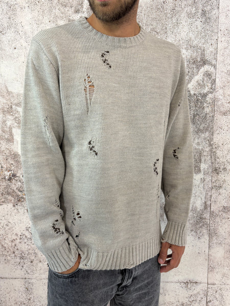 Maglione sabbia rotture e cuciture