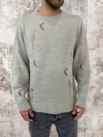 Maglione sabbia rotture e cuciture