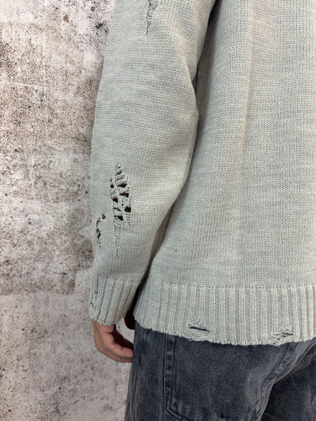 Maglione sabbia rotture e cuciture